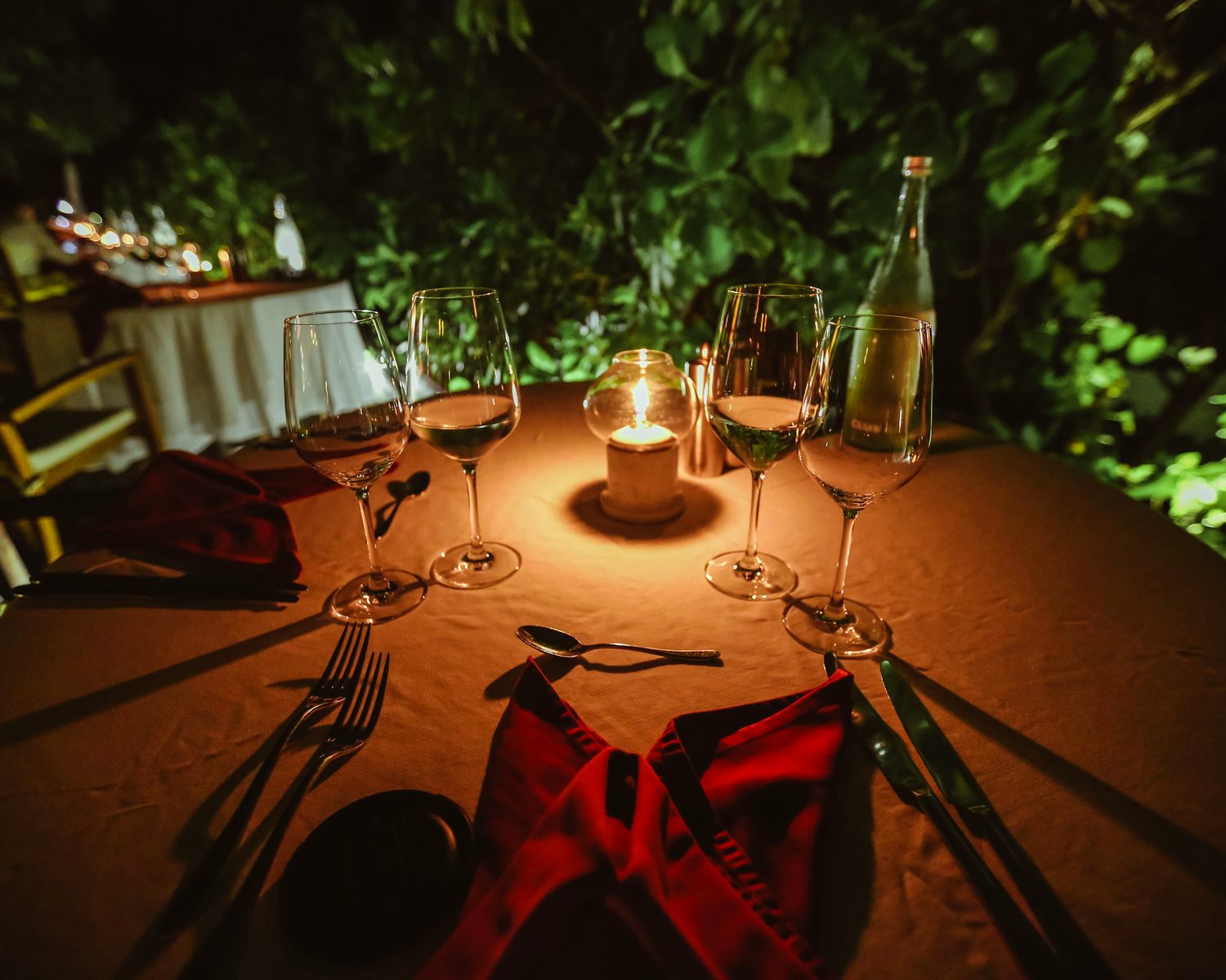 A candlelit table set for an evening of readings