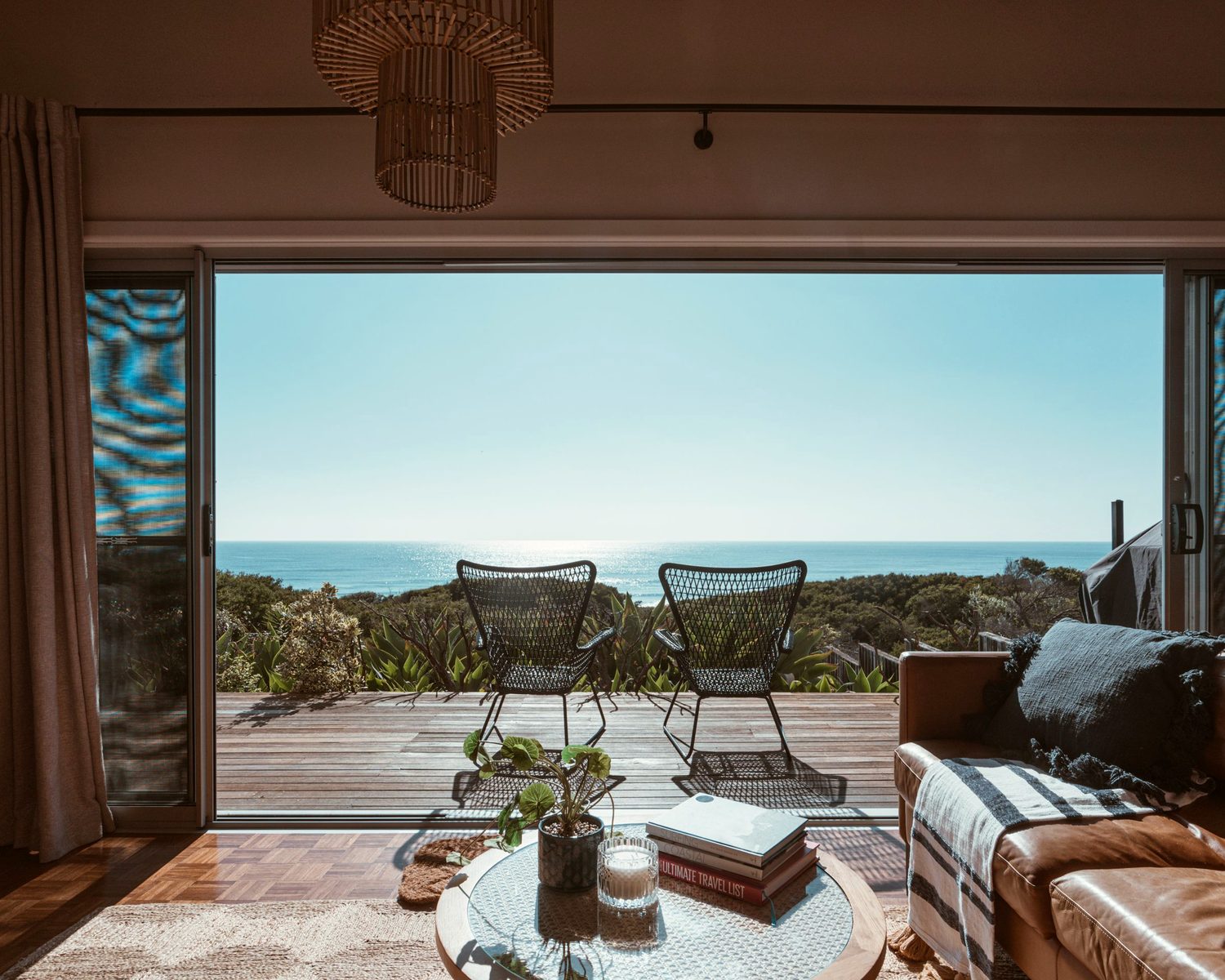 An intimate retreat space opening to the sea